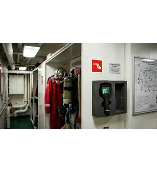 IMO portable infrared thermal imager sign installed on a ship's fire station locker, marking the thermal camera storage next to firefighter gear